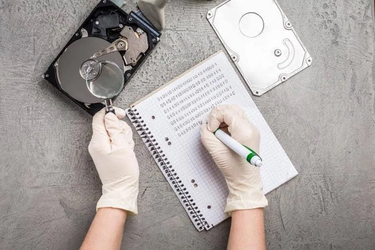 Concept of data recovery, engineer is recovering data from failed hard disk driver